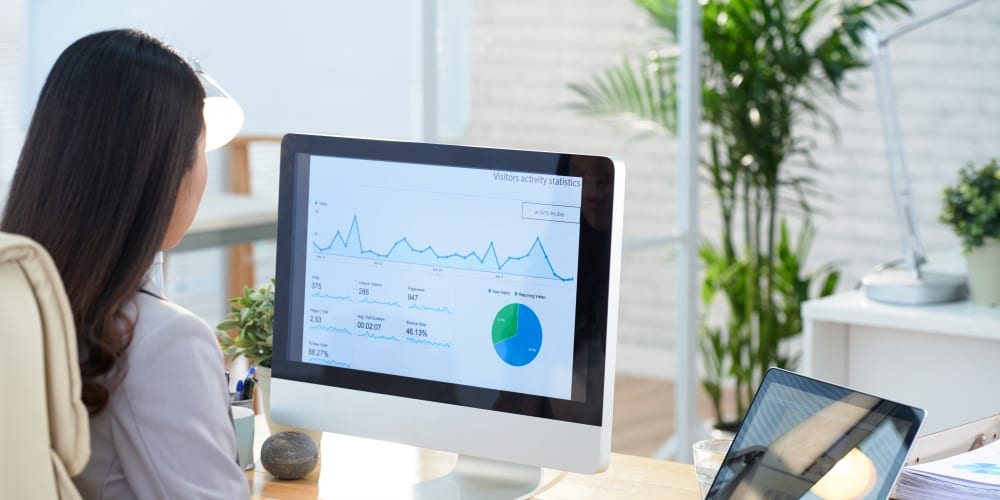 Reading an analytics dashboard at a desk