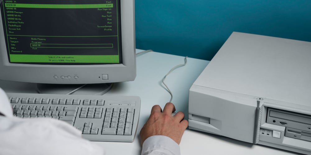 An old desktop tower and CRT monitor still in use