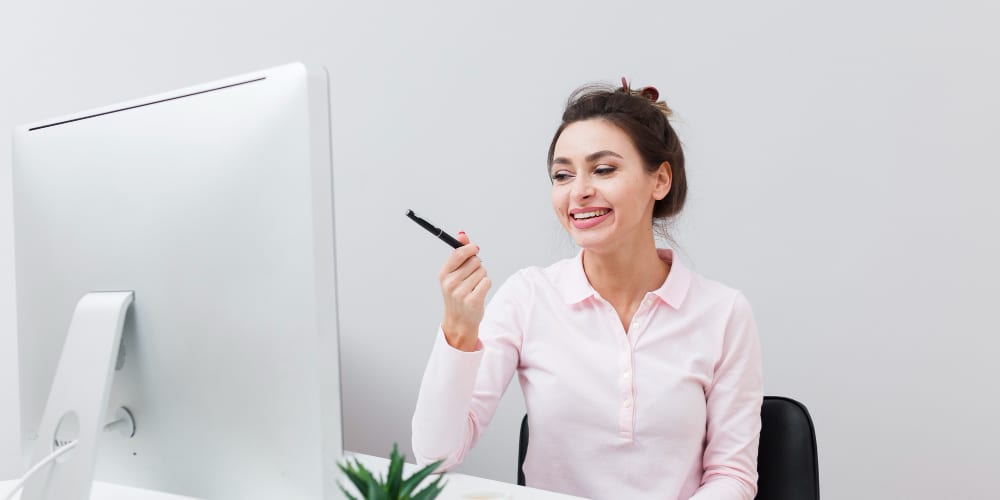Someone reviewing work on screen at a desk