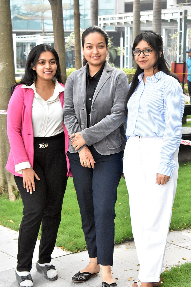 Three of the team outside the office