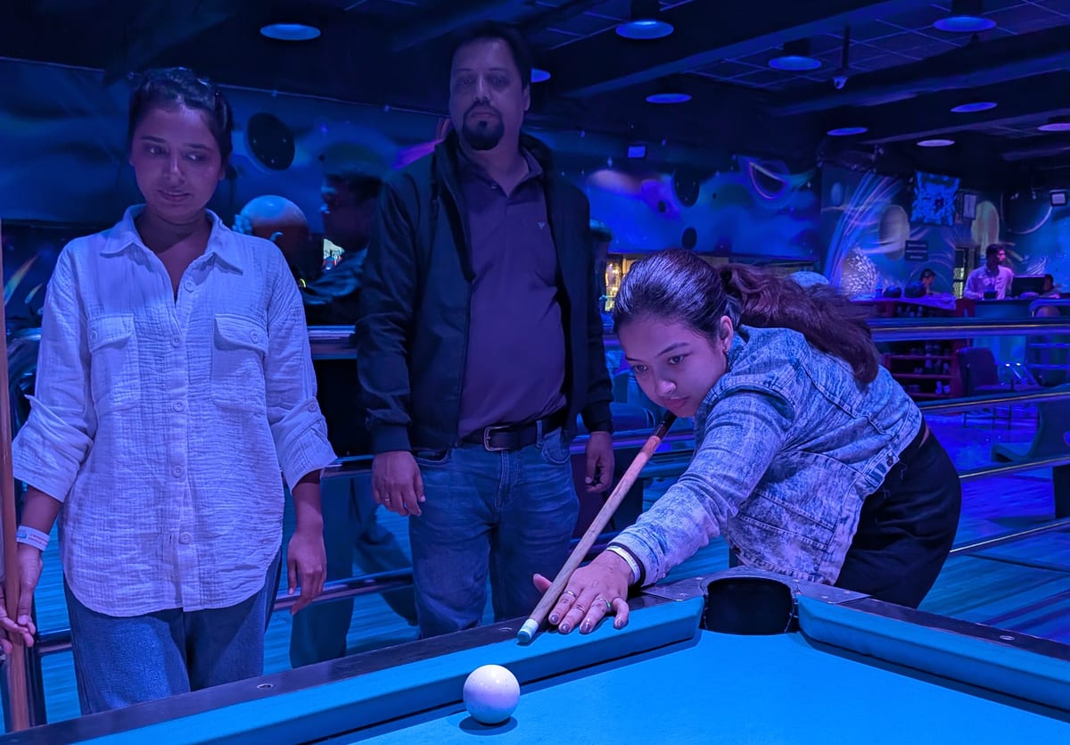 The team playing pool on a night out